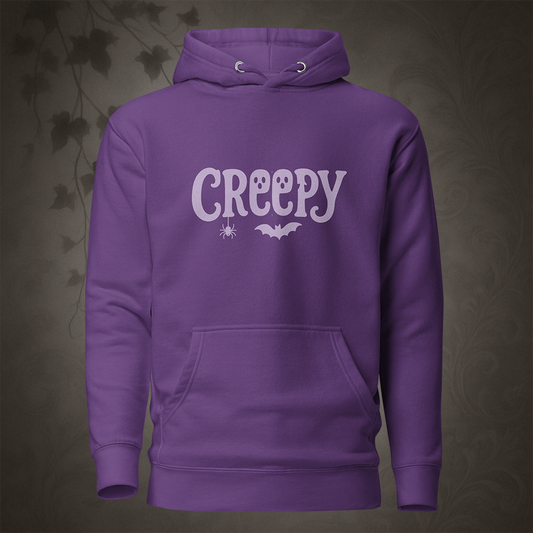 Purple hoodie with 'Creepy' text on a dark background