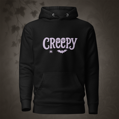 Black hoodie with 'Creepy' text and spider and bat graphics on a dark background
