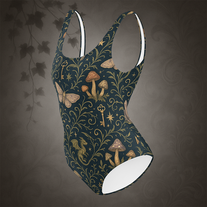 One-piece swimsuit with fantasy-themed pattern on a dark background